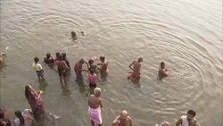 Men wash in a river in India. Stock Footage