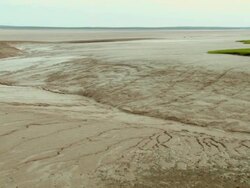 WS PAN View of Tidal mudflat exposed by low tide / Moncton, New Brunswick, Canada Stock Footage