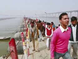 MS Shot of people walking on pontoon bridge over gangas river during kumbh mela / Allahabad, Uttar Pradesh, India Stock Footage