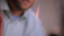 Teacher supervises a student using Bunsen burner Stock Footage