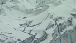 Deep snow fills a gorge in an avalanche area of Alaska. Stock Footage