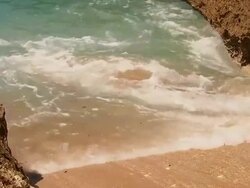 Surf on the small beach between karst rocks, Baracoa, Cuba Stock Footage