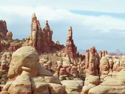 Aerial over pinnacle rock formations in the desert / Southwest USA Stock Footage
