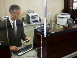 Two colleagues working in bank Stock Footage