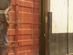 MS Shot of truck with people taking old televisions out of truck / Lagos, Nigeria Stock Footage