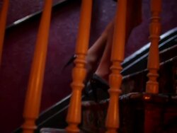 Woman ascending hotel staircase Stock Footage