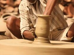 Man making a earthen pot on a pottery wheel, Faridabad, Haryana, India Stock Footage