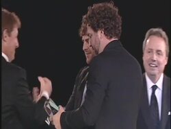Dallas Davidson, Rhett Akins (receiving award) at the 59th Annual BMI Country Awards at Nashville TN.  Stock Footage