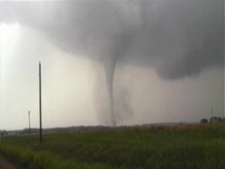 Long slender tornado Harper, Kansas, zooms in to base of funnel and debris cloud, WA, USA Stock Footage