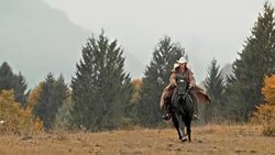 SLO MO DS Female riding a galloping horse in meadow Stock Footage