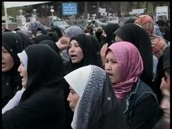 More than 100 Afghan women protested against a new marriage law they say restricts wives' rights. Some counter-protesters pelted the women with small stones. News Clip