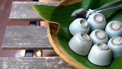 coconut milk custard in small porcelain cup Stock Footage