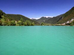 Navigation on emerald green lake Stock Footage