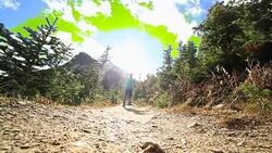 Woman running uphill Stock Footage