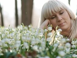 HD DOLLY: Laying Among Spring Snowflakes Stock Footage