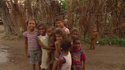 Village children pose near a swamp in the Dominican Republic. Stock Footage