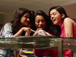 Three college students eating food in the college Stock Footage