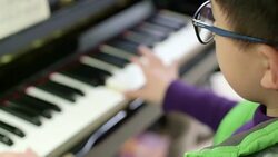 boy playing the piano Stock Footage