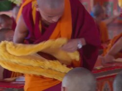 MS Buddhist monk giving ceremonial headgear in Kopan Monastery/ Kathmandu, Central, Nepal Stock Footage