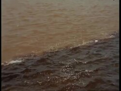 MS High angle tracking over choppy water as the Amazon and Rio negro meet, South America Stock Footage