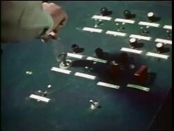 1960s close up man's hand turning key to shoot missiles on control panel / Cold War / documentary Stock Footage