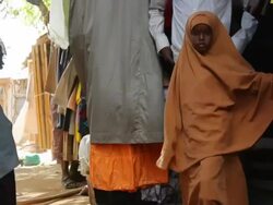 Young Muslim girl walking in the street Stock Footage