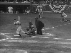 B/W 1955 batter hitting ball + running / PAN to runner sliding into third base, umpire calling play Stock Footage
