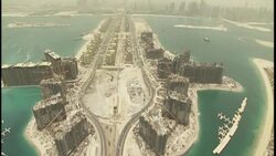 The man-made archipelagos of Palm Jumeirah and the Palm Islands are seen from the air. Stock Footage