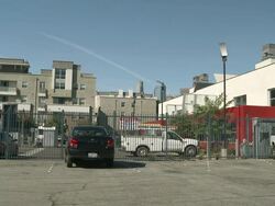MS Cars parked on exterior of fabric in Los Angeles / Los Angeles, California, United States Stock Footage