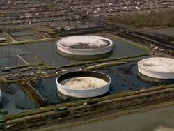Sept. 10, 2005 aerial flooded oil storage tanks in wake of Hurricane Katrina / Chalmette, Louisiana Stock Footage