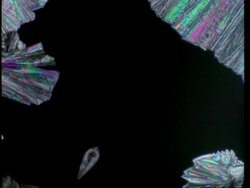 T/L colourful crystals grow across to fill frame Stock Footage