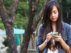 Woman texting on her phone Stock Footage