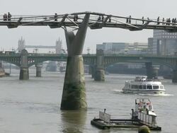 MS View of millenium bridge and tower bridge / London, England, Great Britain  Stock Footage