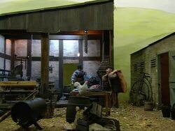 Miniaturised late Victorian scene, blacksmith, Dolls house, Leonardslee Gardens, West Sussex, UK Stock Footage