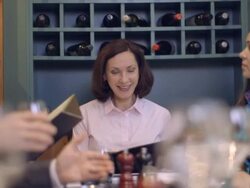 MS TU Businesswoman holding digital tablet and giving presentation in restaurant Stock Footage
