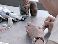 CU PAN Shot of Artist making Matryoshka doll at the park / Nerima, Tokyo, Japan Stock Footage