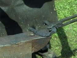 Blacksmith making horseshoe Stock Footage