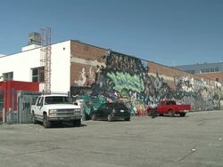 MS Cars parked on exterior of fabric in Los Angeles / Los Angeles, California, United States Stock Footage