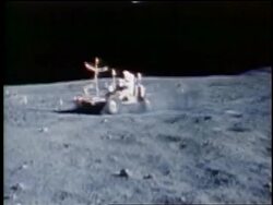 1972 PAN astronaut driving lunar rover on surface of Moon / Apollo 16 Stock Footage