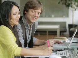  CU PAN Young creative co-workers discussing on project / New York, USA Stock Footage