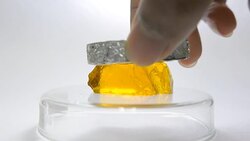 weight sample bearing for experiment of yellow gel Stock Footage