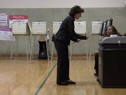 MS, Woman inserting voting ballot into ballot box, Chicago, Illinois, USA Stock Footage