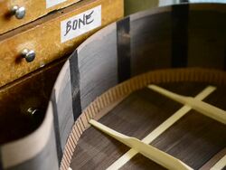 Craftsman 'Luthier' Nigel Forster making hand made Guitars Stock Footage