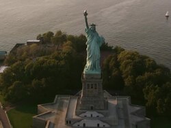 Aerial flying over Statue of Liberty at the end of the day, NYC Stock Footage