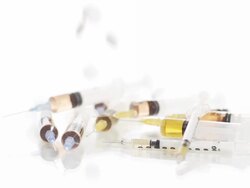 HD SLOW MOTION: Pills Falling Over Syringes Stock Footage