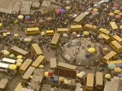WS AERIAL DS ZO View of traffic circle in market / Lagos, Nigeria Stock Footage