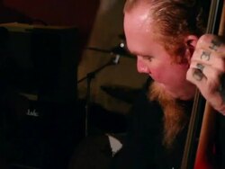 HANDHELD Musician playing bass in bar / Jacksonville Beach, Florida, United States Stock Footage