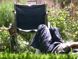 (HD1080i) Wheelchair Man resting in Park as World Passes By Stock Footage