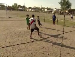 MS TS Shot of kids playing football on ground / Buenos Aires, Argentina Stock Footage