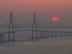 WS T/L View of Sunset scene of Incheon Grand Bridge (is South Korea's longest spanning cable-stayed bridge ) / Incheon, South Korea  Stock Footage